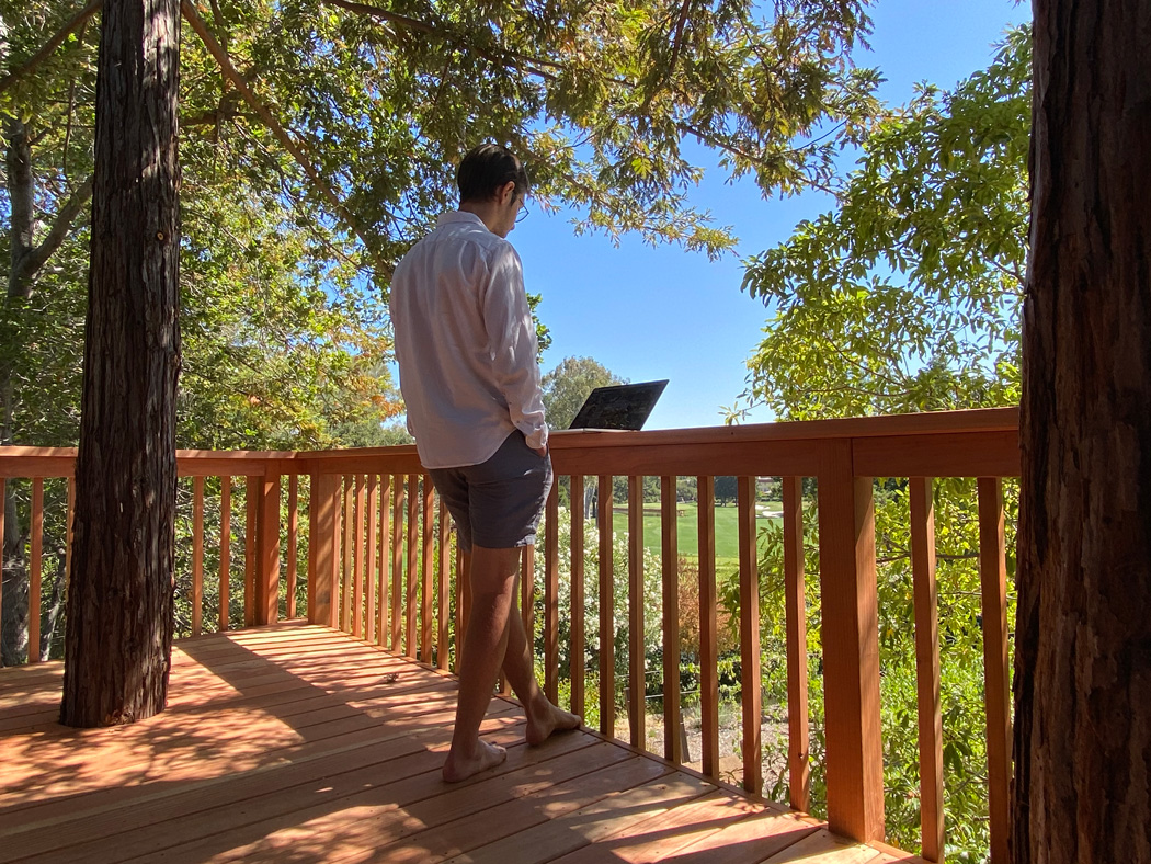 Standing in the treehouse with my laptop